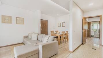 Apartment, 1 Bedroom | Living area | 28-inch flat-screen TV with satellite channels, TV