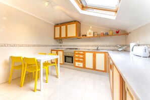 Studio, City View | Private kitchen | Full-sized fridge, microwave, oven, stovetop - Casa Mouraria I Castle Views (Lisbon)