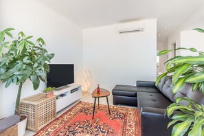Apartment, 1 Bedroom, City View | Living area | Flat-screen TV