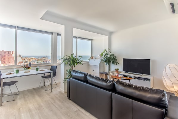 Apartment, 1 Bedroom, City View | Living area | Flat-screen TV