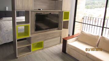 Deluxe Apartment, 1 Bedroom, Non Smoking, City View | Living room | Flat-screen TV