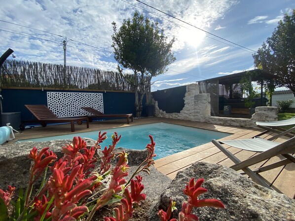 Seasonal outdoor pool, pool umbrellas, pool loungers