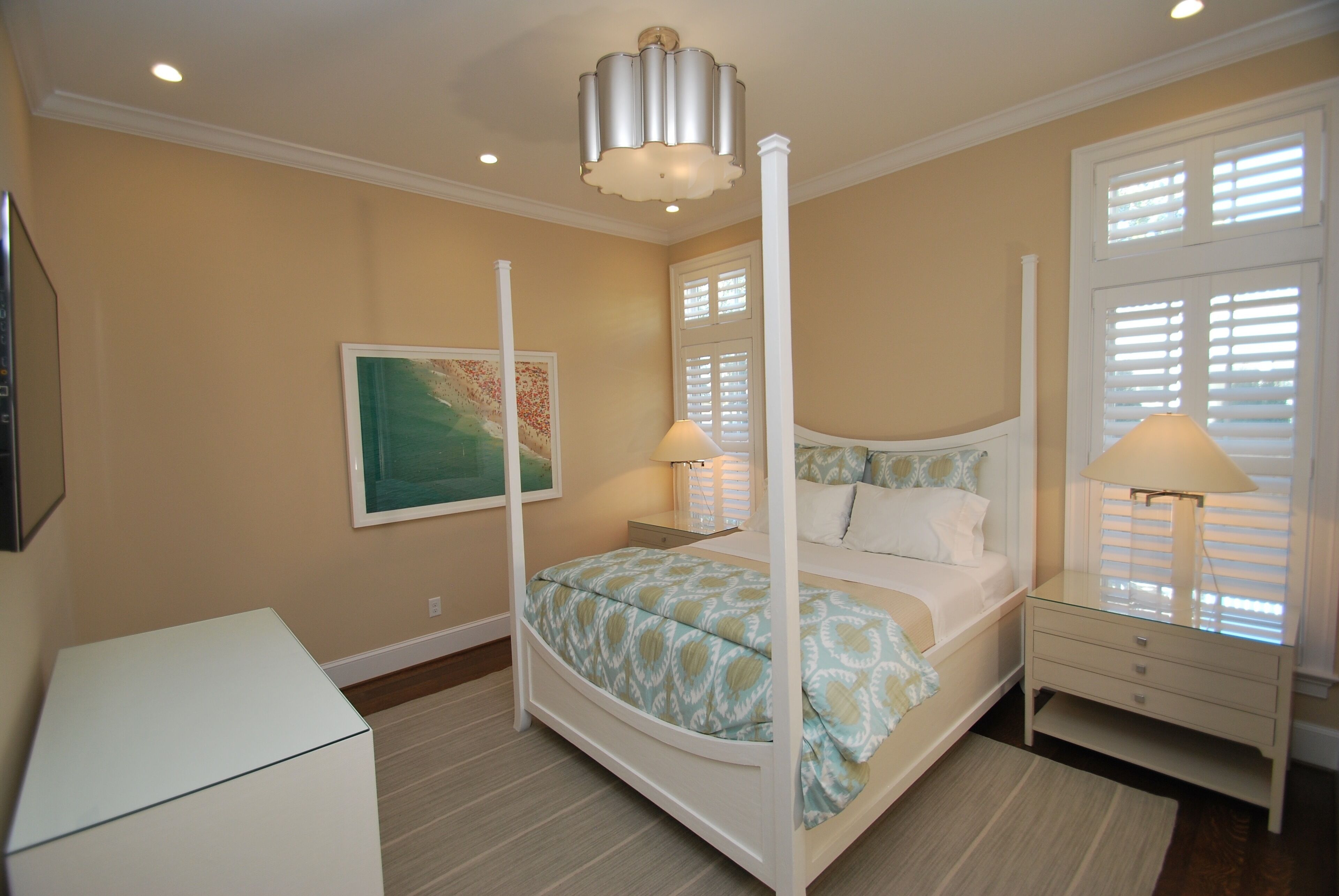 1st floor bedroom (Bed 2) with queen bed, television, ensuite bath and beautiful resort like decor.