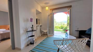 Junior Suite | Living area | 32-inch Smart TV with satellite channels
