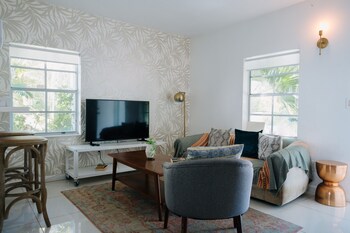 Hotel room living space at Miami River Inn By Renzzi