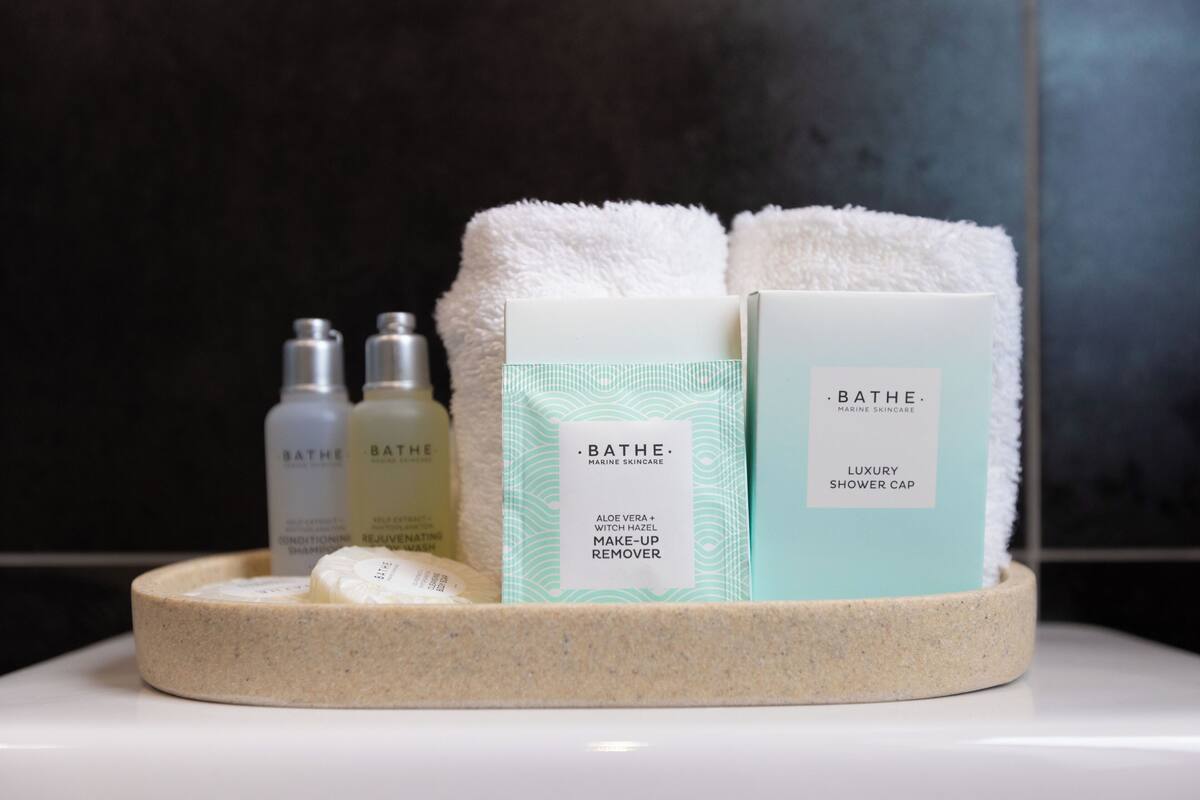 shower, free toiletries, hair dryer, towels