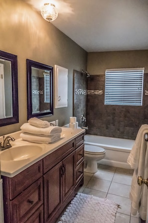 Combined shower/tub, hair dryer, towels, soap