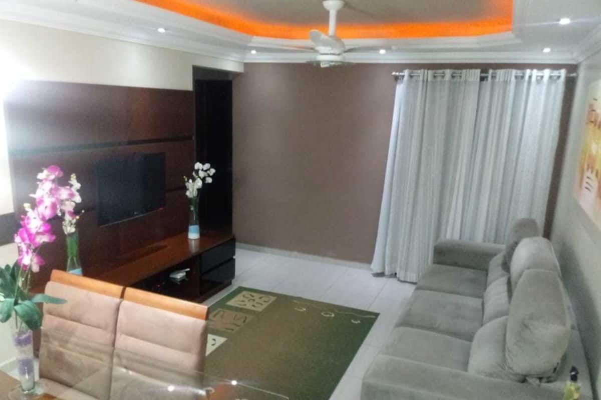 Deluxe Apartment, 3 Bedrooms | Living room | Flat-screen TV