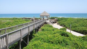 A wooden boardwalk leading to a gazebo with a view of the ocean. - BIS-Duck Resort - 1BR/1.5BA - Great Pools and Beach! (Duck)