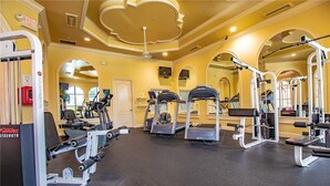 A gym with treadmills, weight machines, and mirrors. - ***  2 bd, 2 bath  Luxury 5 star Italian  Resort, on the hedge of the  Tampa Bay (Clearwater)