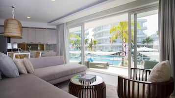 Premier One Bedroom Suite Pool View | Living area | 43-inch flat-screen TV with cable channels, TV