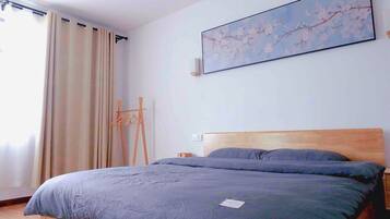 Premium bedding, down duvets, desk, laptop workspace