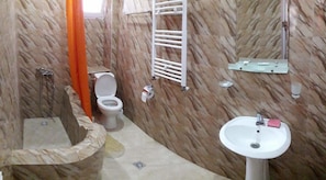 Apartment, Kitchen | Bathroom | Combined shower/tub, deep soaking tub, slippers