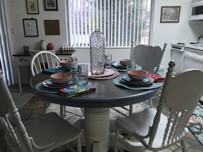 A dining table set with bowls, glasses, and a decorative vase. - Park City 25 minutes away.  Close to snow skiing.  Large private 1 bedroom condo (West Valley City)