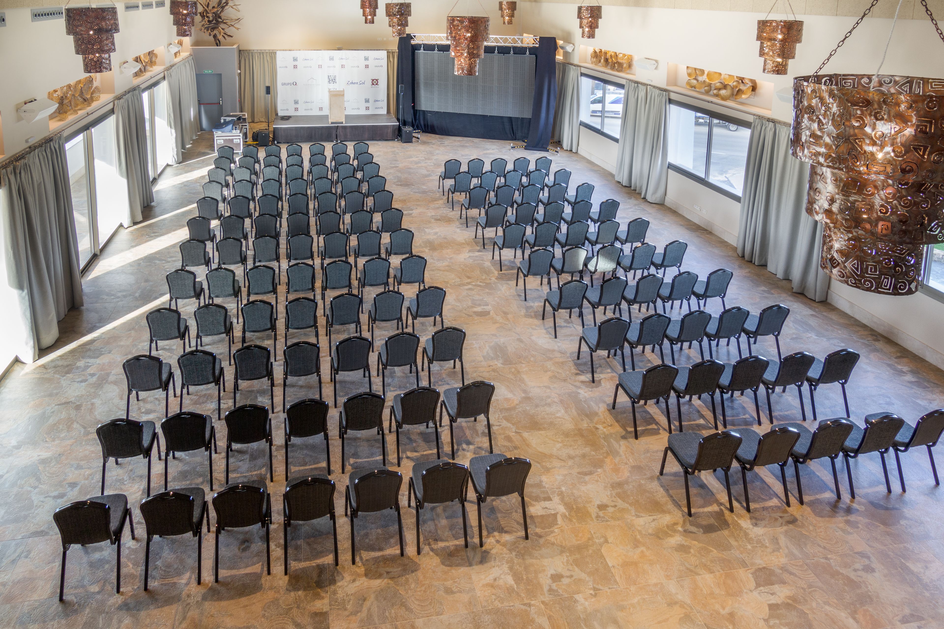 A conference room with rows of chairs arranged for a meeting.