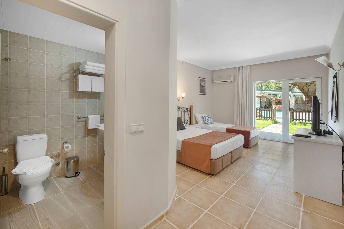 family room, 2 bedrooms, garden view, garden area | 1 bedroom, premium bedding, minibar, soundproofing