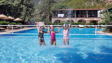 Seasonal outdoor pool, open 9:00 AM to 7:00 PM, pool umbrellas