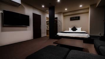 Premium Penthouse, 1 Queen Bed, Hot Tub, City View | Pillow-top beds, individually decorated, individually furnished, desk