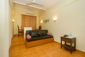 Suite, 1 cama King size | Área de sala de estar