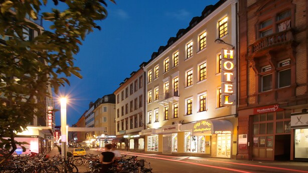 A hotel with multiple stories, large windows, and a prominent 'HOTEL' sign. - City-Hotel Aschaffenburg (Aschaffenburg)
