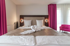 Hypo-allergenic bedding, minibar, in-room safe, blackout drapes