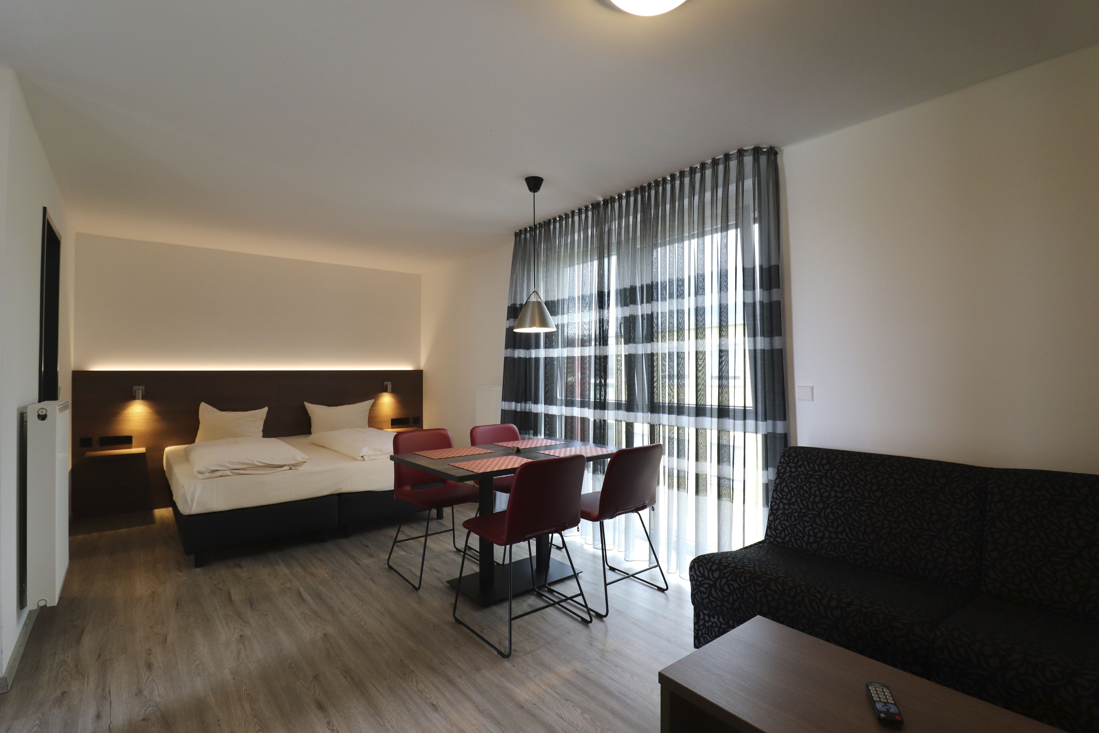 comfort appartement | living area | flat-screen tv