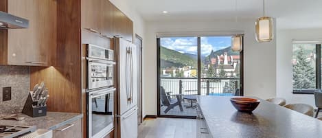 Condo, 4 Bedrooms | Private kitchen | Fridge, oven, coffee/tea maker, toaster