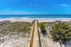 A wooden boardwalk leading to a beach with clear skies. - Misty Morning South - Oceanfront 4BR Home; Dog Friendly! (Surf City)