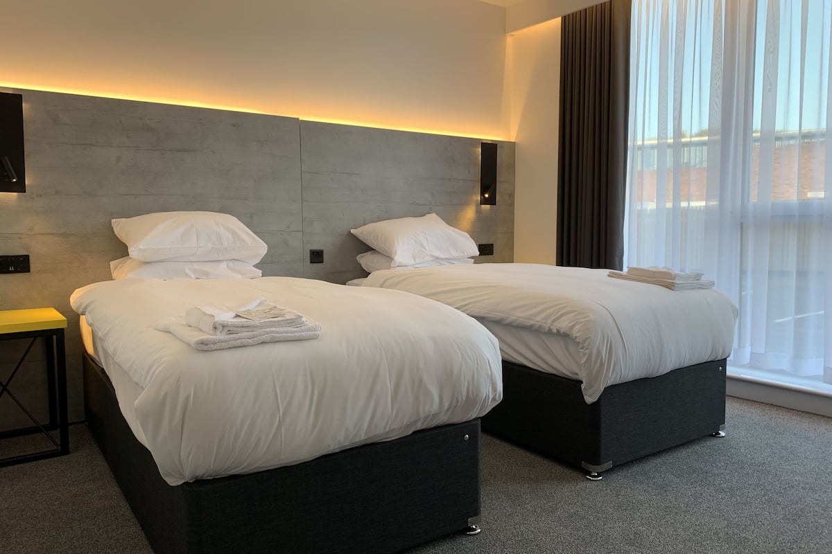 deluxe twin room | in-room safe, desk, soundproofing, iron/ironing board