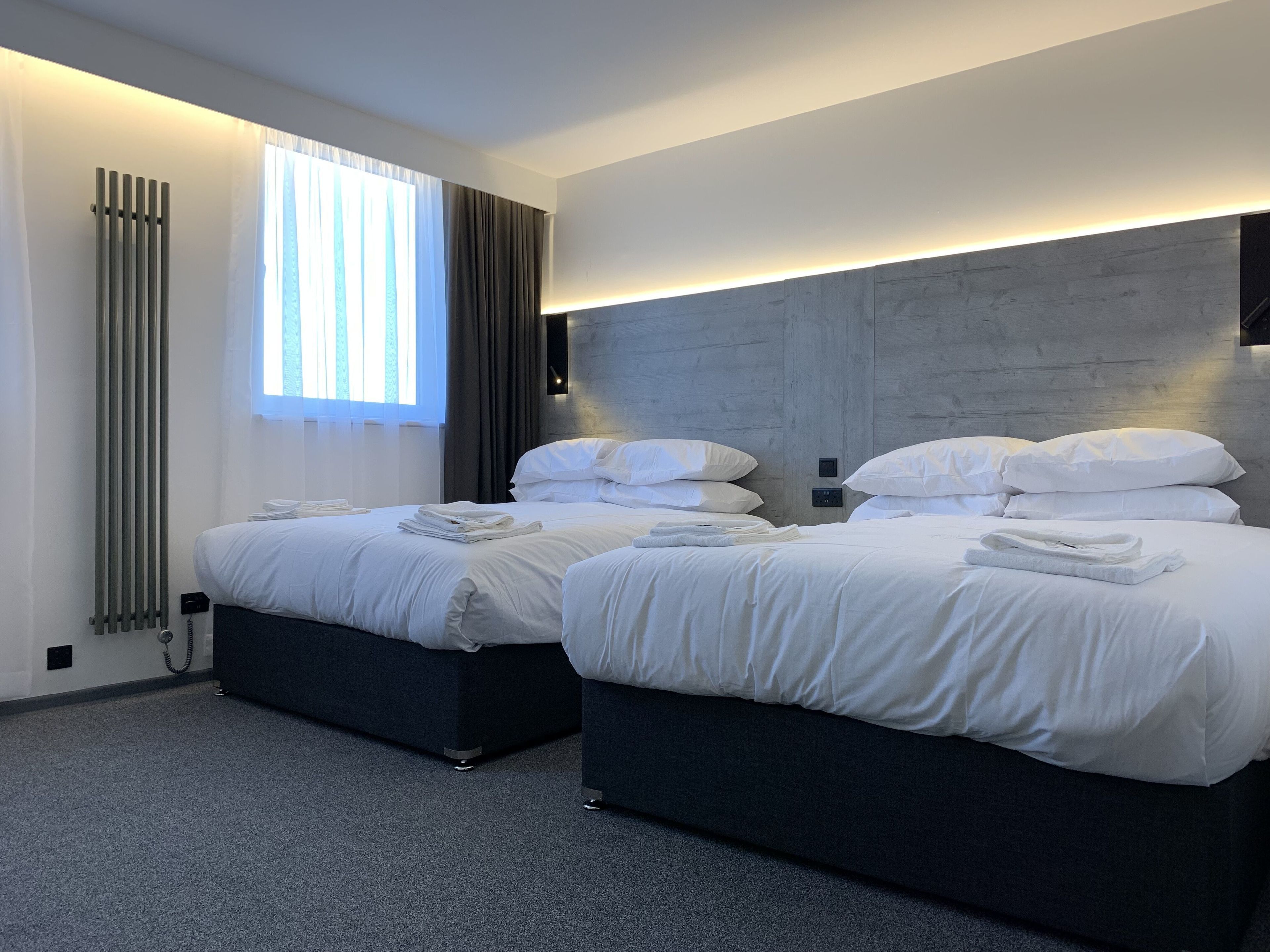 deluxe family room | in-room safe, desk, soundproofing, iron/ironing board