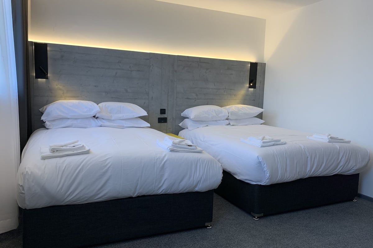 deluxe family room | in-room safe, desk, soundproofing, iron/ironing board