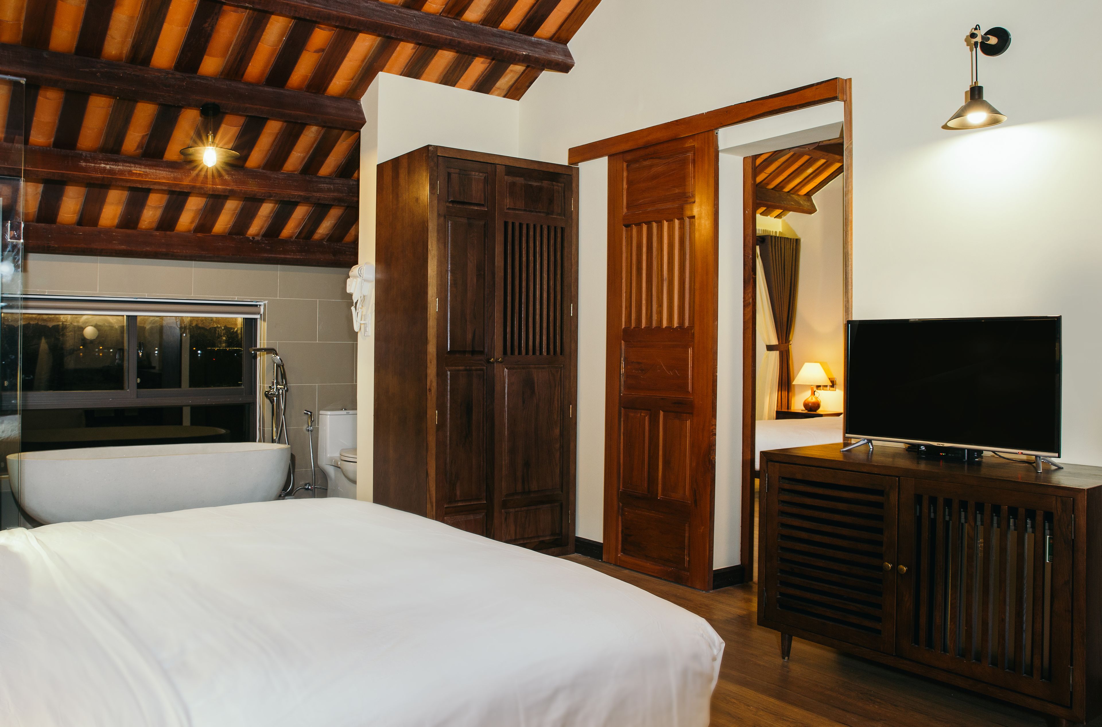 luxury suite, river view | minibar, in-room safe, desk, blackout curtains