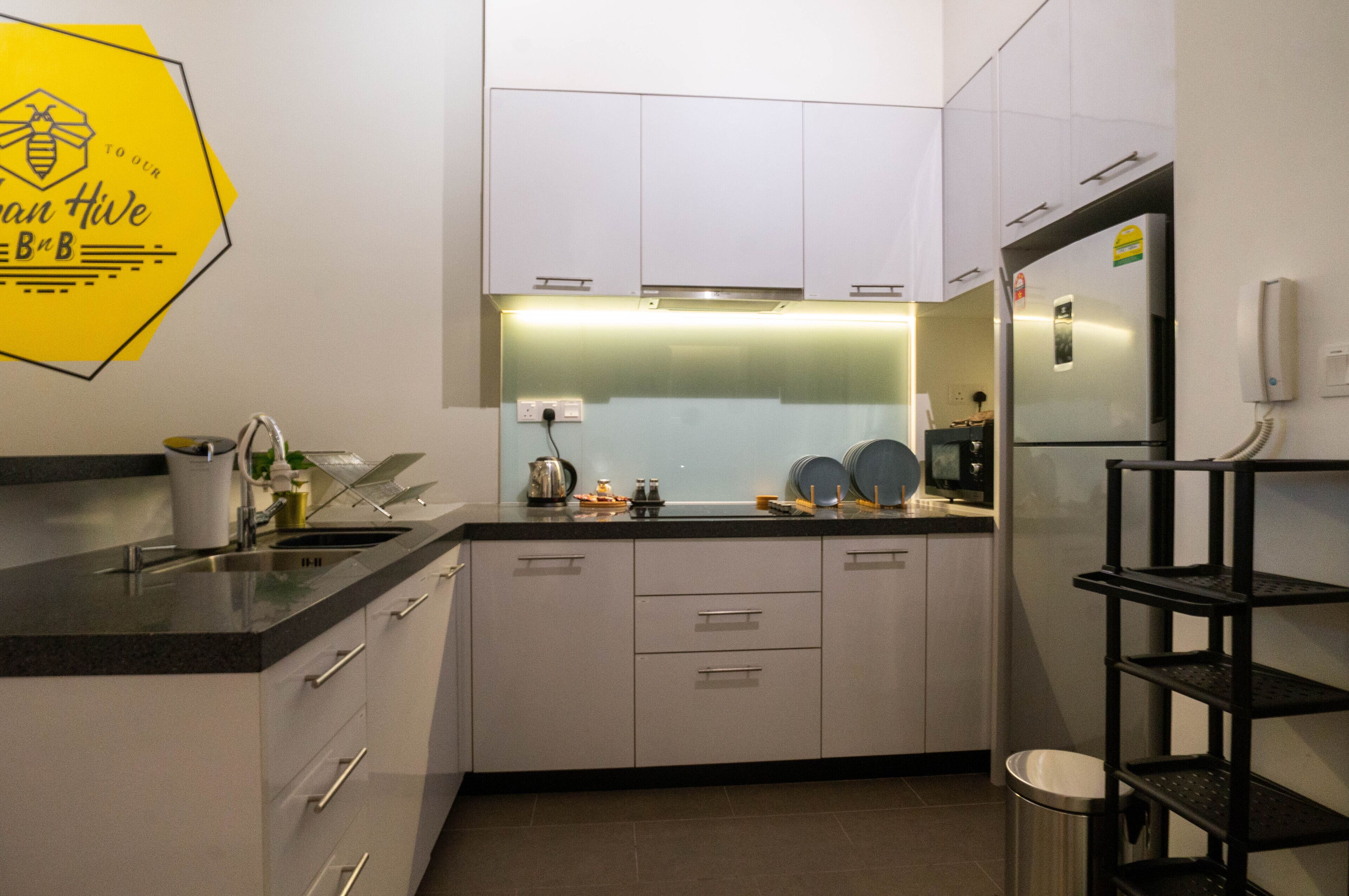 Fridge, microwave, electric kettle, cookware/dishes/utensils