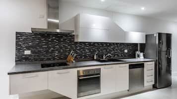 Luxury Apartment, Multiple Beds | Private kitchen | Full-size fridge, microwave, oven, stovetop