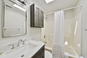 Combined shower/bathtub