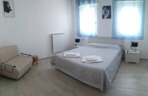 Habitación Deluxe | Colchones con acolchado adicional y decoración individual