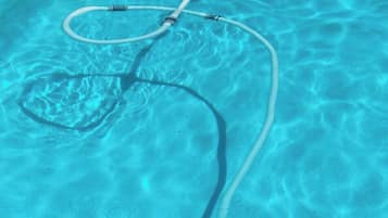 Seasonal outdoor pool, open 10:30 AM to 8:00 PM, pool umbrellas