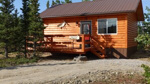 A small wooden cabin with a metal roof, a porch, and a sign that reads "MOOSE". -  Denali Wildlife Moose Cabin  Luxury with a touch of Rustic (Healy)