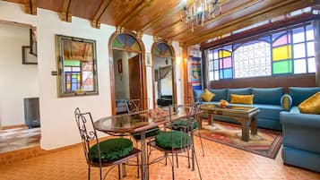 Apartment, 2 Bedrooms, Smoking, Ocean View | Living area | 32-inch flat-screen TV with satellite channels, TV
