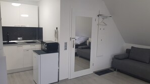Apartment, Multiple Beds | Private kitchen | Full-size fridge, microwave, stovetop, espresso maker - Unique Airport-Fair (Steinenbronn)