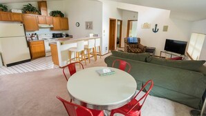 A compact living space with a kitchen, dining area, and a living room. - Gorgeous location and getaway! Pickleball court! (Lakebay)
