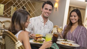 A dining area with wicker chairs and a table set for three people. - Direct Oceanfront Guest Room w/ Great View + Official On-Site Rental Privileges (Myrtle Beach)