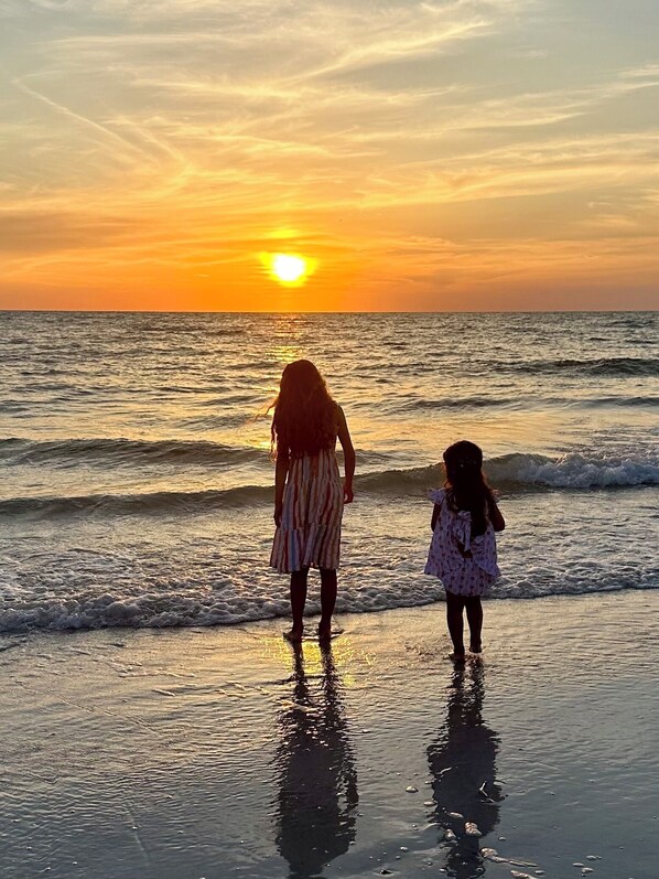 On the beach, sun-loungers