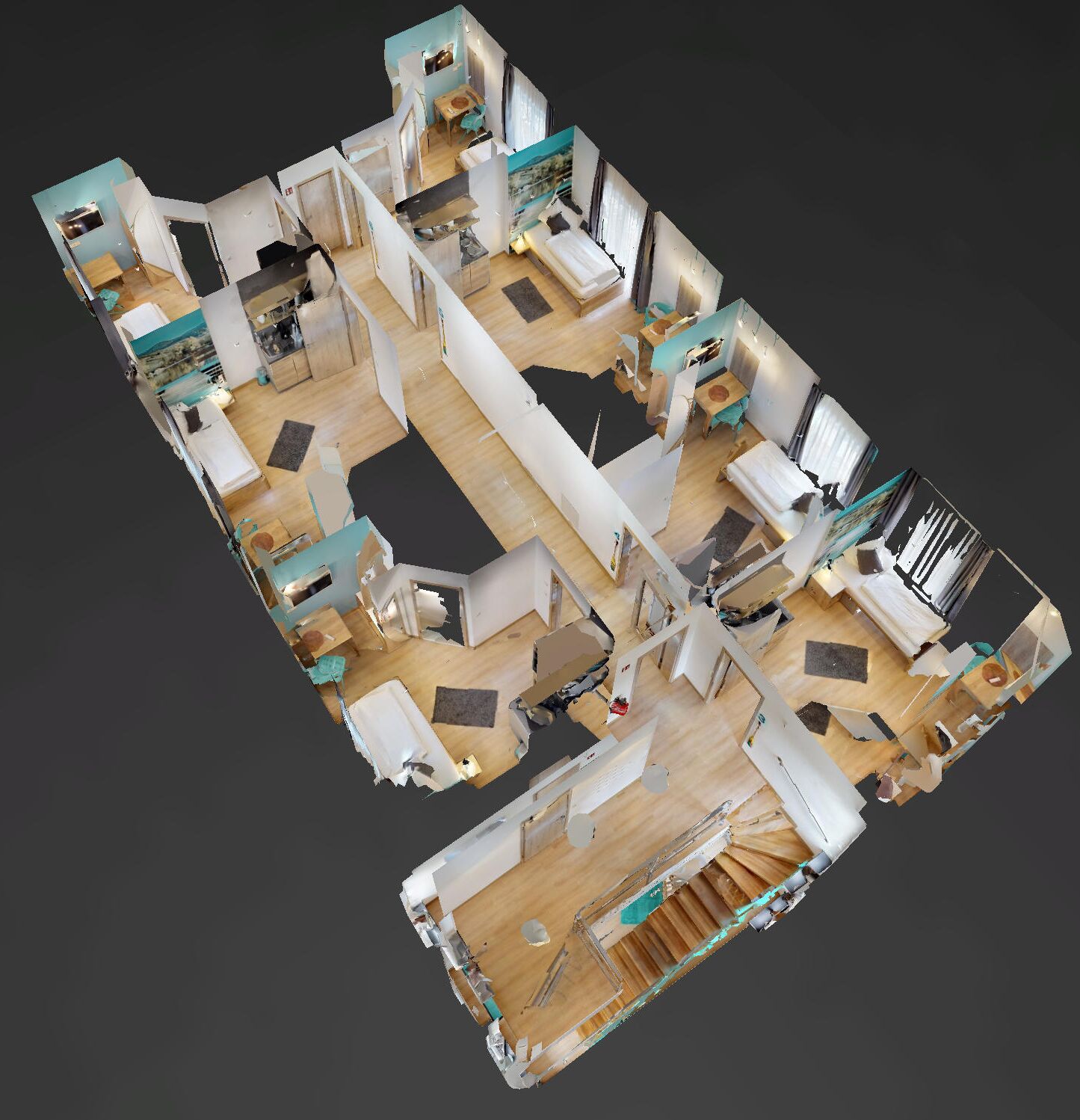 Ein 3D-Modell des Grundrisses eines Hotelzimmers mit Küche, Essbereich und Treppe.