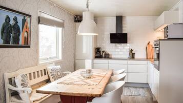 Fridge, stovetop, dishwasher, coffee/tea maker