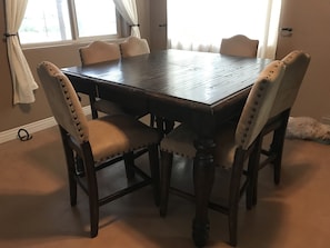 Enjoy meals and meetings in this well-appointed dining area with a large table and comfortable seating for six.
