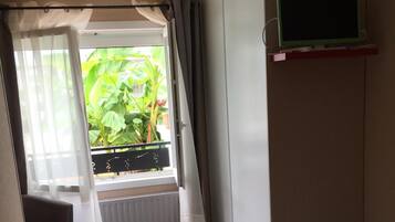 2 bedrooms, blackout drapes, soundproofing, iron/ironing board