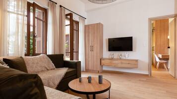 Suite Confort | Coin séjour | Télévision à écran plat