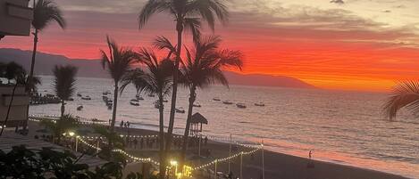 On the beach, sun loungers, beach towels