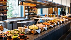 A buffet setup with various food items and beverages. - Mitsui Garden Hotel Ginza Gochome (Tokyo)